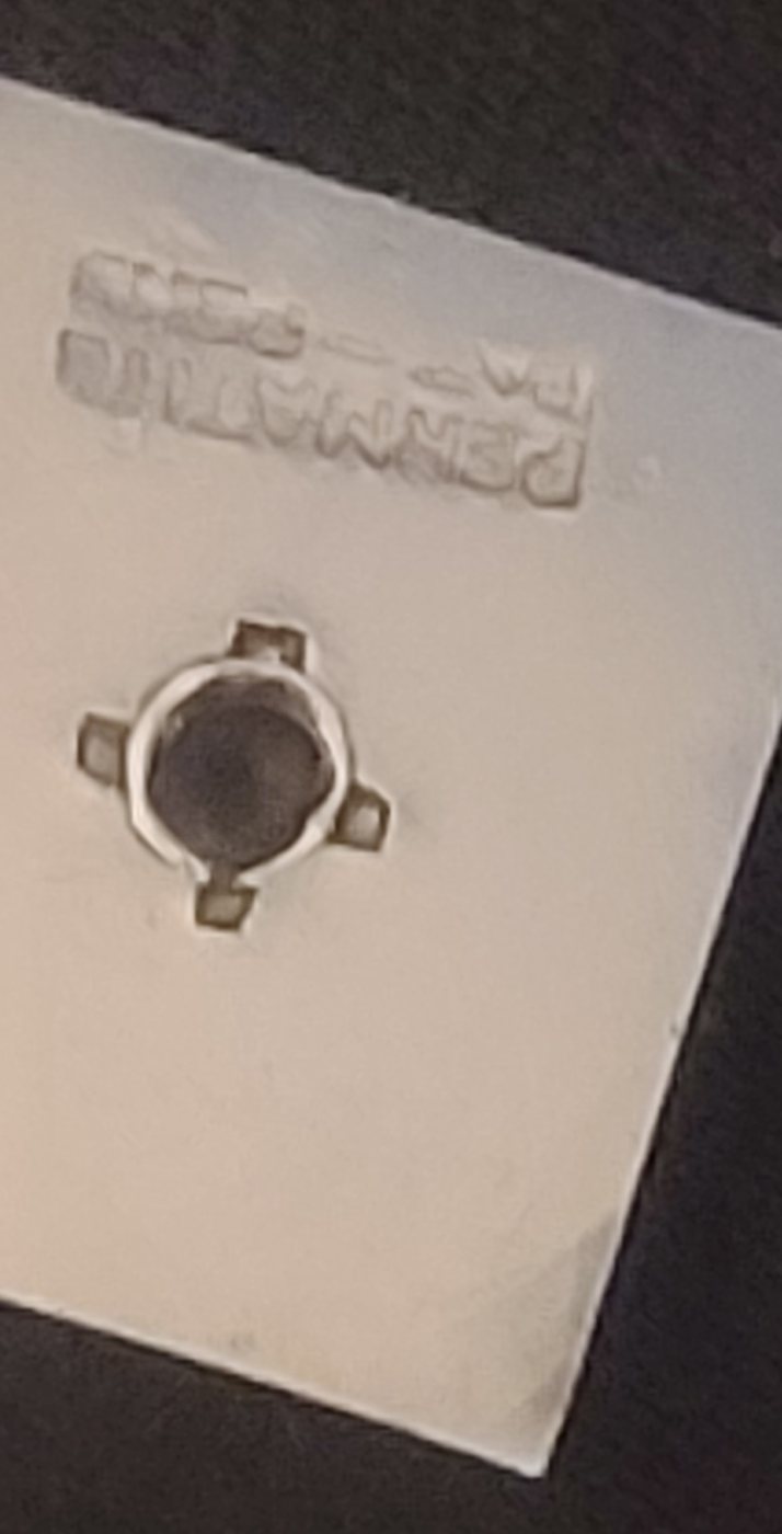 Small white hardware plate stamped "PERMATIC / PAT. PEND."
